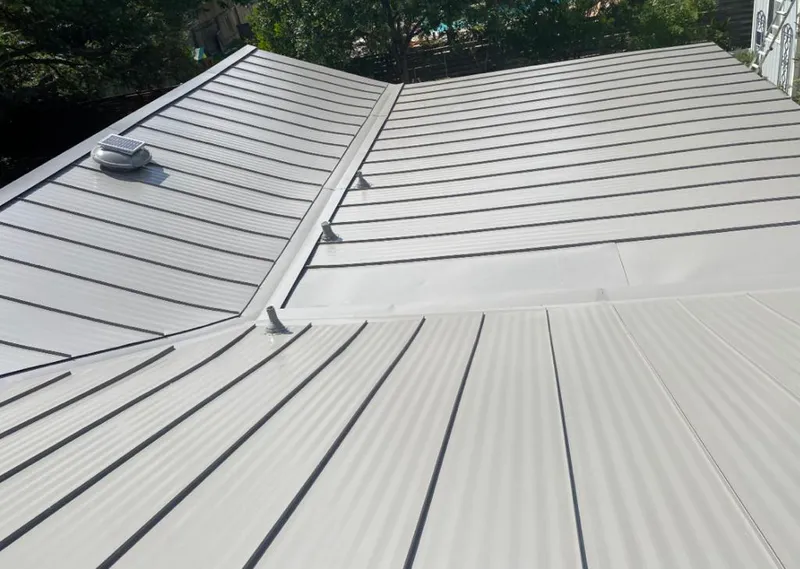Solar attic fan installed on a metal roof for Roof Ventilation in Sweden